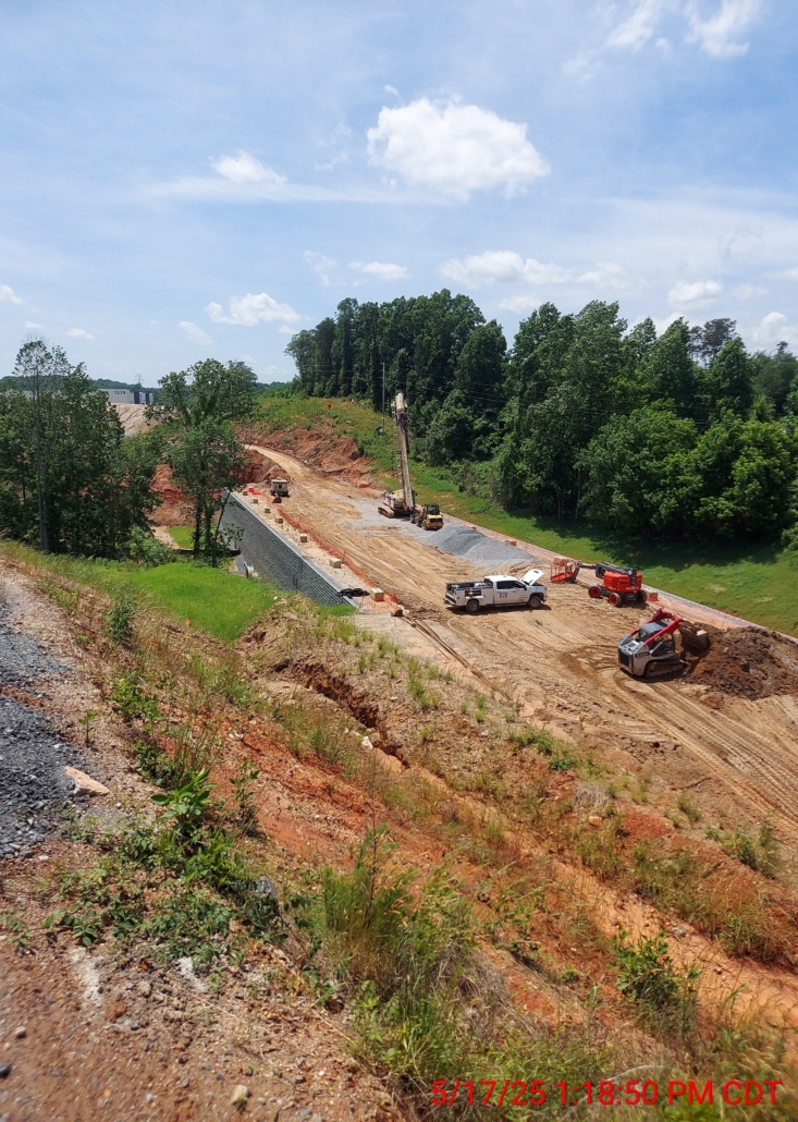 GastonCommerce_Aggregate Pier_Rigid Inclusion_CNCFoundations4 Panoramic shot of CNC Foundations project site in Gastonia, NC showing aggregate pier layout, drill rigs, and slope stabilization for a 280,000 square foot logistics warehouse.
