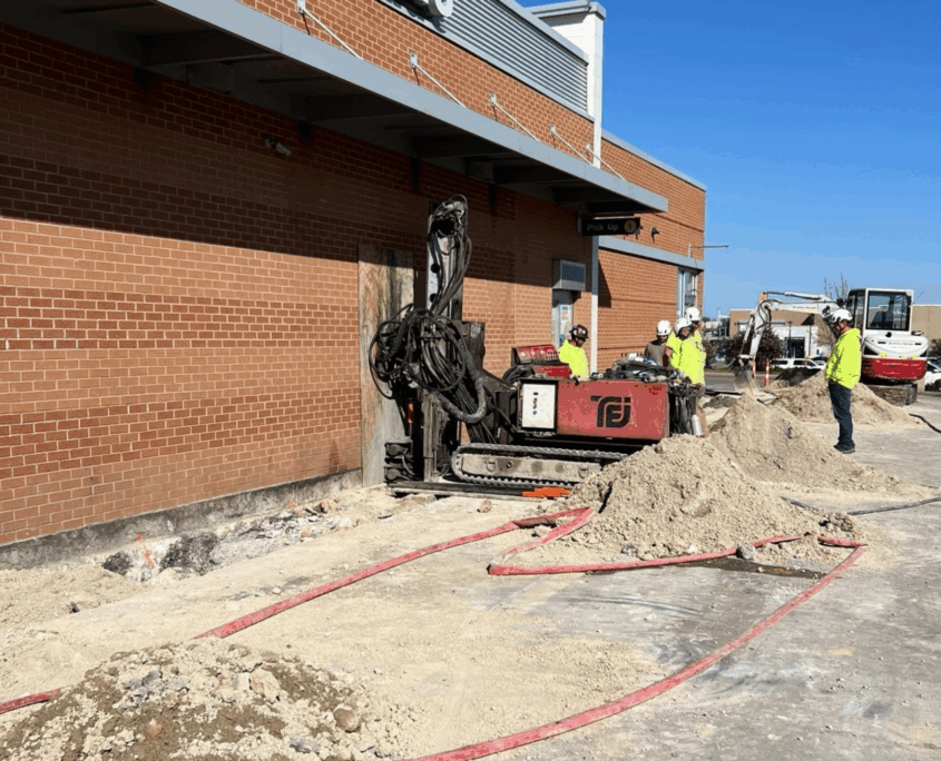 Wide view of CNC Foundations team installing a micropile foundation system at a McDonald’s location, demonstrating precision construction in deep fill environments.