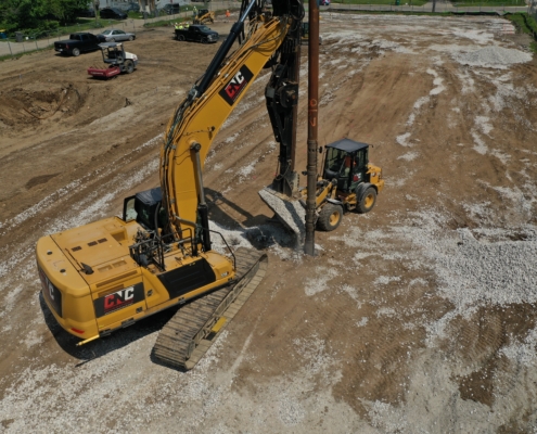 CNC Foundations crew installing aggregate piers at a large commercial construction site.