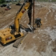CNC Foundations crew installing aggregate piers at a large commercial construction site.