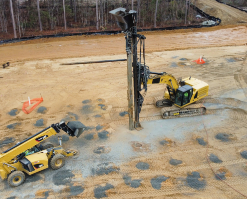 Aggregate pier installation equipment improving soil conditions at a CNC Foundations ground improvement project.