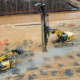 Aggregate pier installation equipment improving soil conditions at a CNC Foundations ground improvement project.