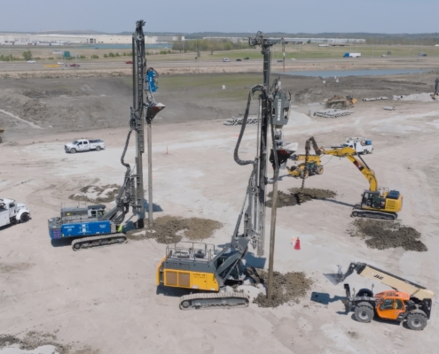 CNC Foundations crews installing aggregate piers at a large commercial construction site