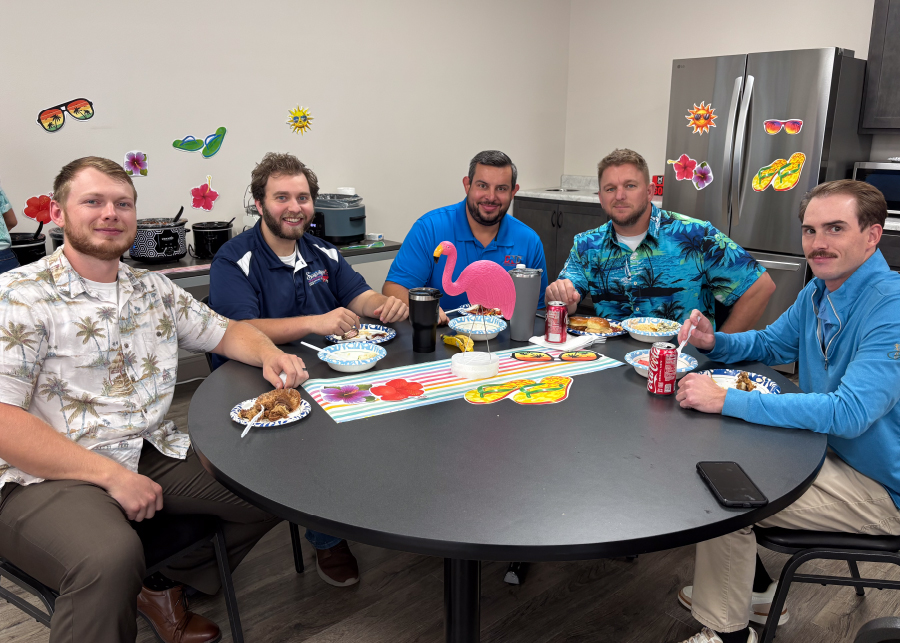 CNC office team sharing a meal in the break room